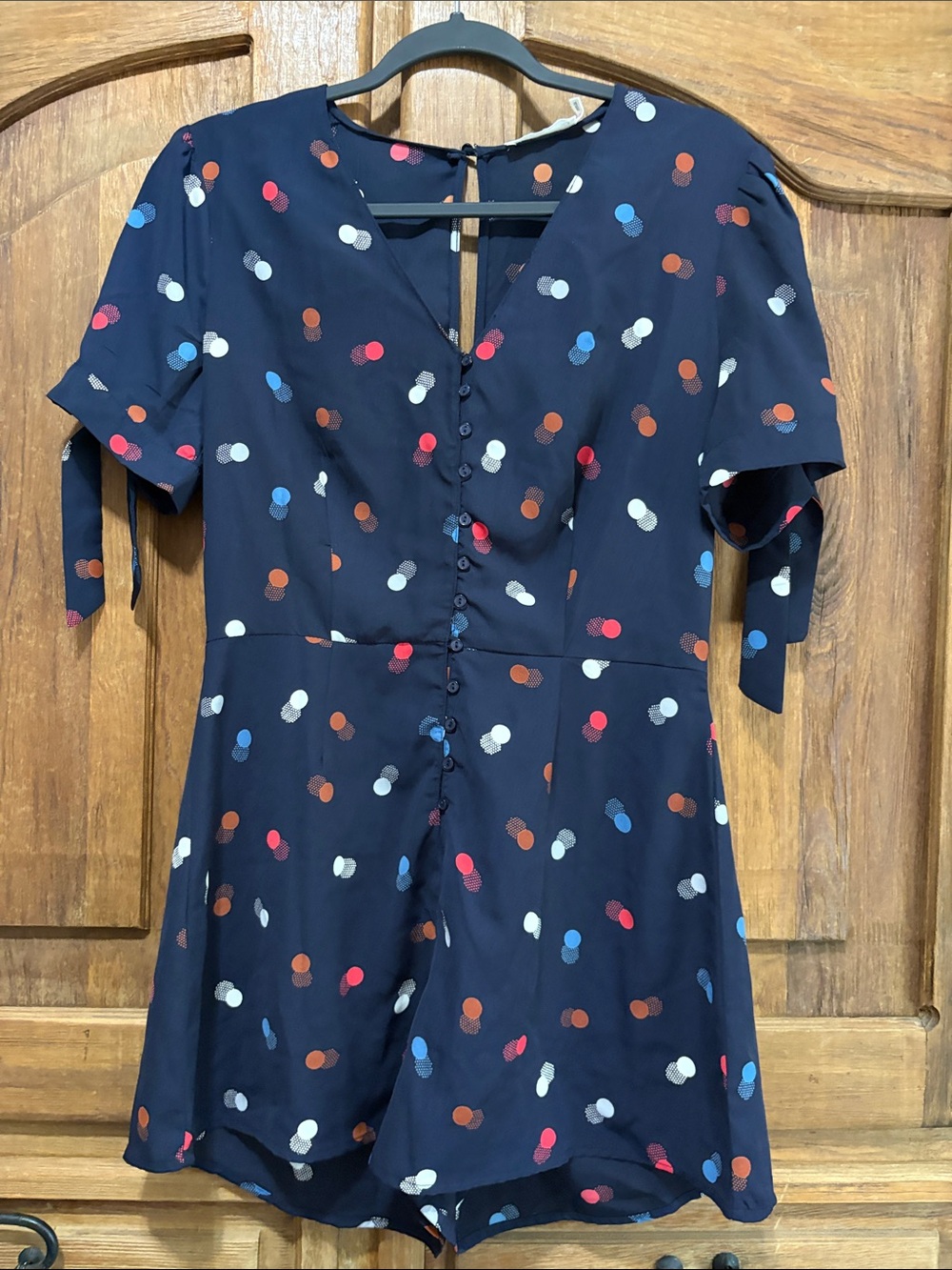 Lush Navy Polka Dot Short Sleeve Romper with Tie Sleeves